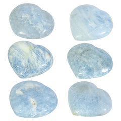 Nupuyai blue Celestite heart placed on a table to create serene energy
