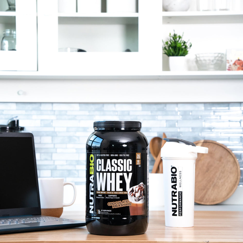 NutraBio Classic Whey chocolate milkshake in glass, flavorful protein option.