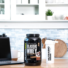 NutraBio Classic Whey chocolate milkshake in glass, flavorful protein option.