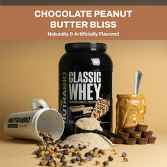 NutraBio Classic Whey scoop pouring into a glass for easy mixability