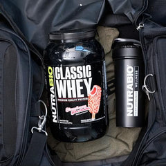NutraBio Classic Whey scoop being dispensed into a shaker for a quick shake.