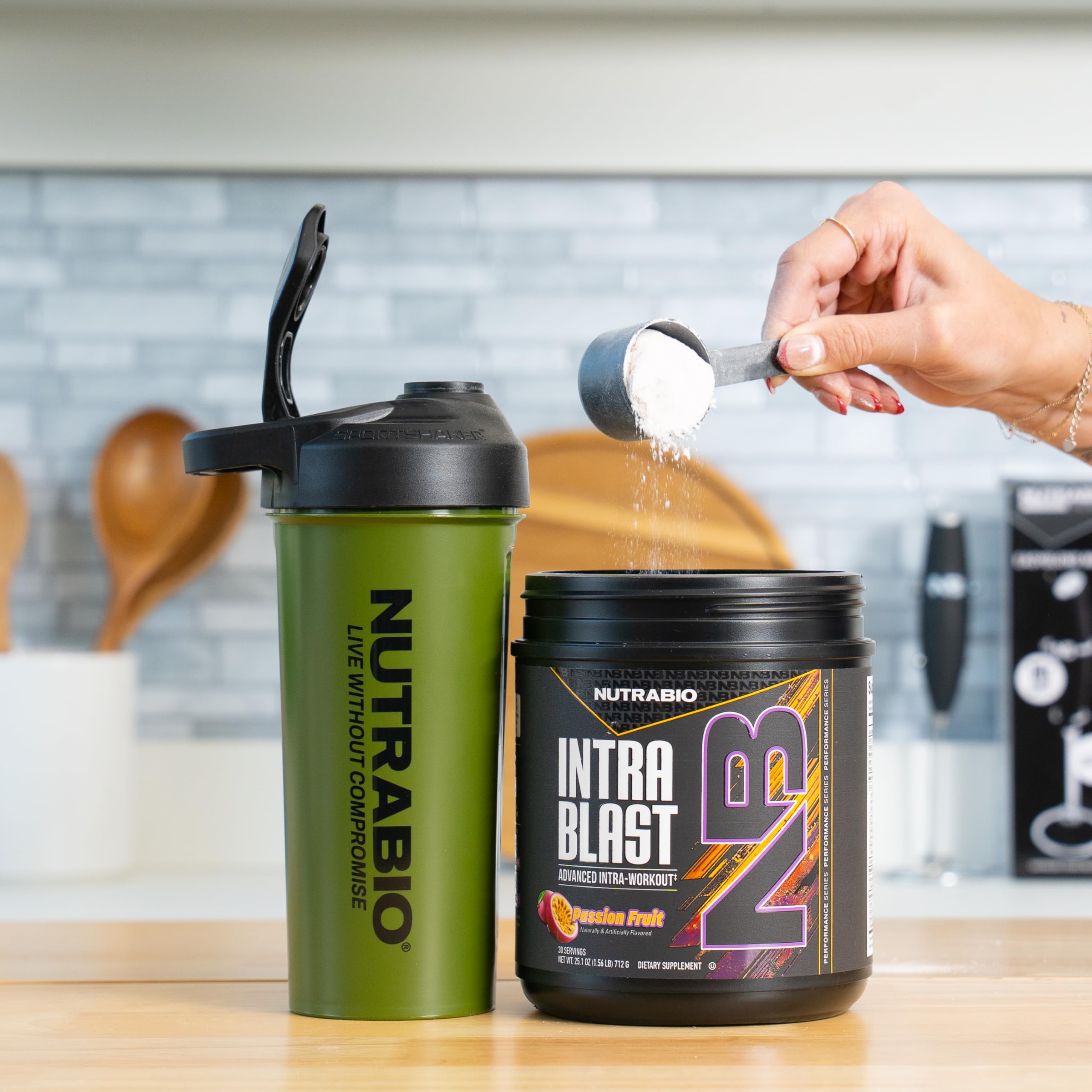 NutraBio Intra Blast dissolving in glass of water mid-workout.