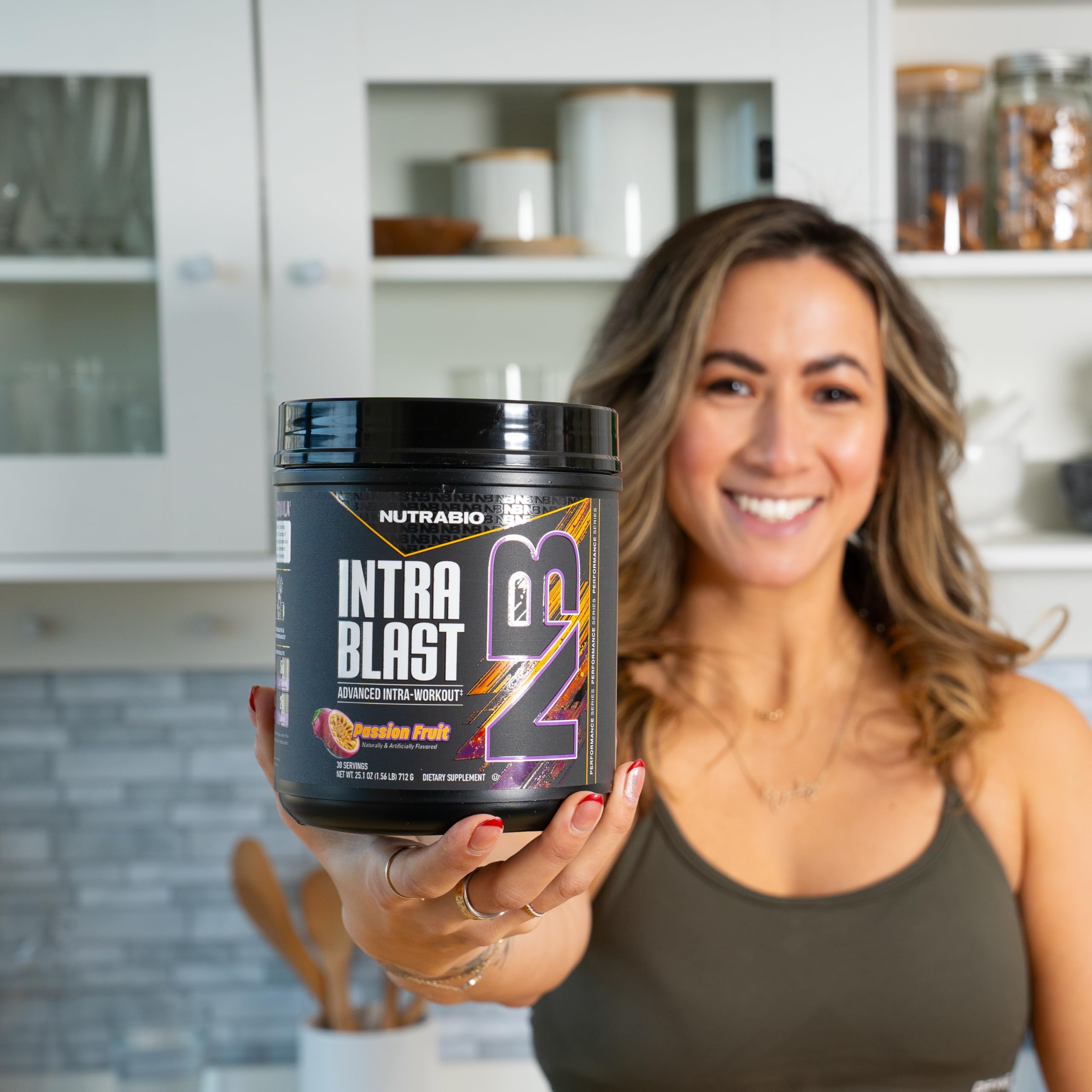 NutraBio Intra Blast powder on kitchen scale shows precise measurement.