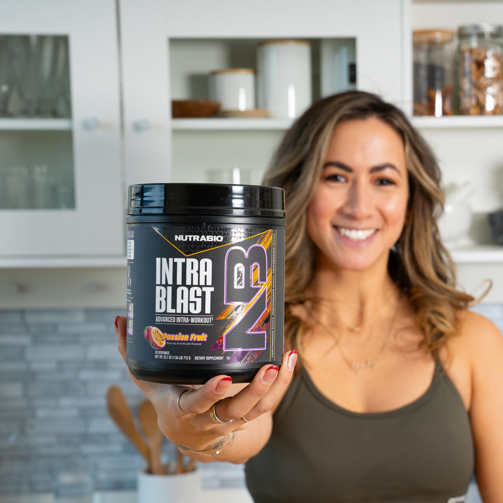 NutraBio Intra Blast powder on kitchen scale shows precise measurement.