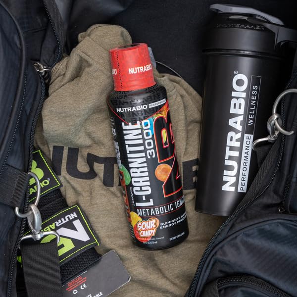 NutraBio L-Carnitine bottle glass close-up highlights sour candy flavor.