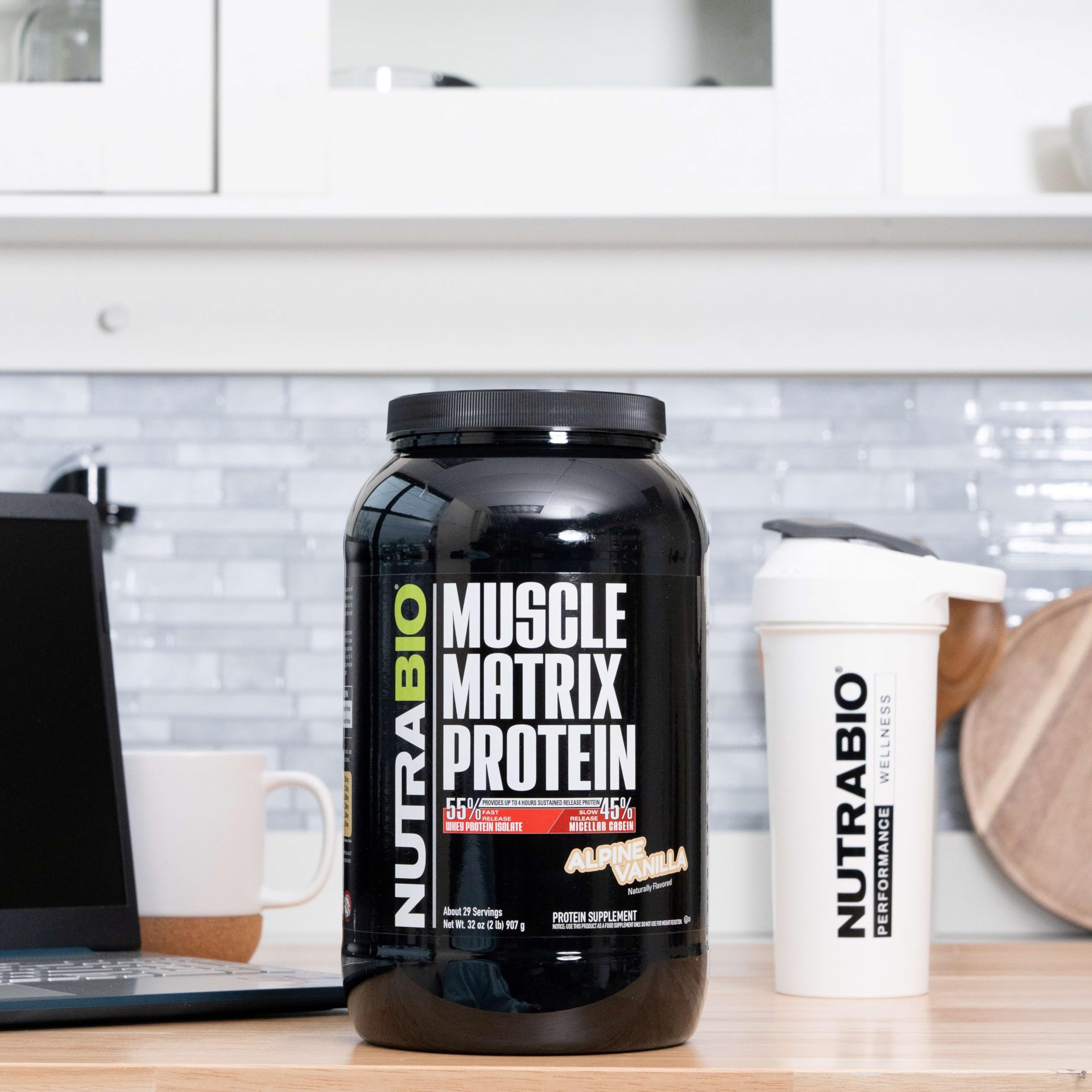 NutraBio Muscle Matrix scoop demonstrates precise portioning for daily protein intake