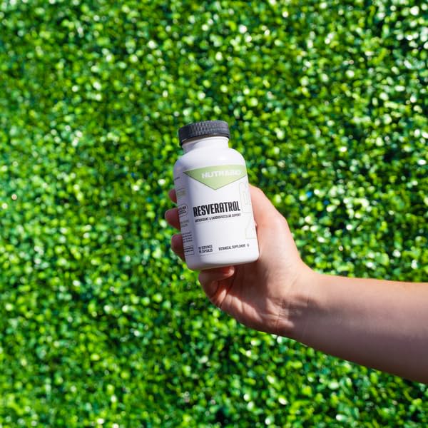 NutraBio Resveratrol capsules closeup showing high potency.