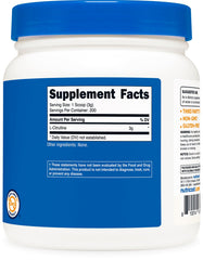 Pouring Nutricost L-Citrulline Base into a glass for a drink.