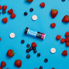 Nuun Bev Tube Energy Wild Berry bottle with water highlights portable active hydration.