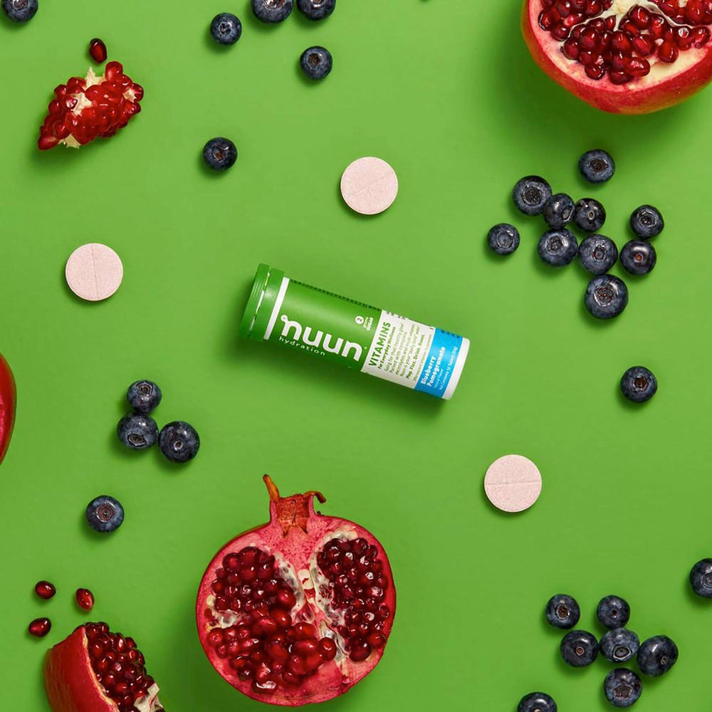 Glass with bubbles features Nuun Blueberry Pomegranate delivering flavorful, low-calorie hydration.