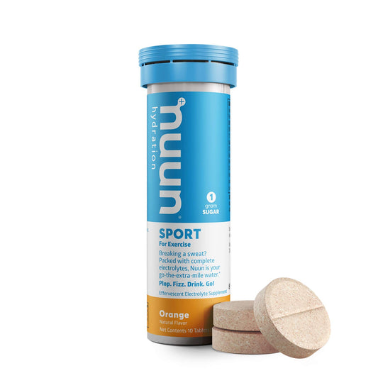 Nuun Sport Orange tablets dissolving in water for refreshing hydration.