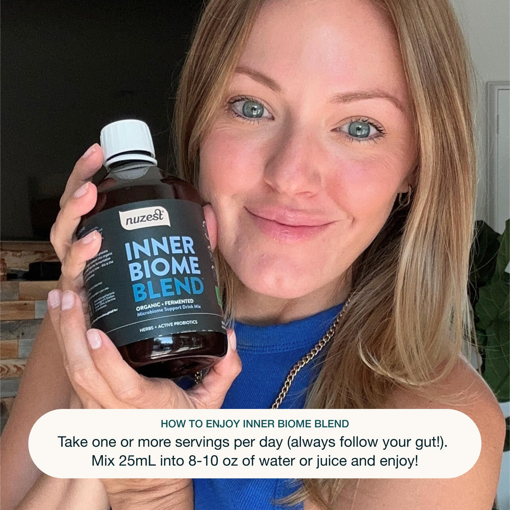 Nuzest Inner Biome daily-use scoop beside bottle implies easy preparation