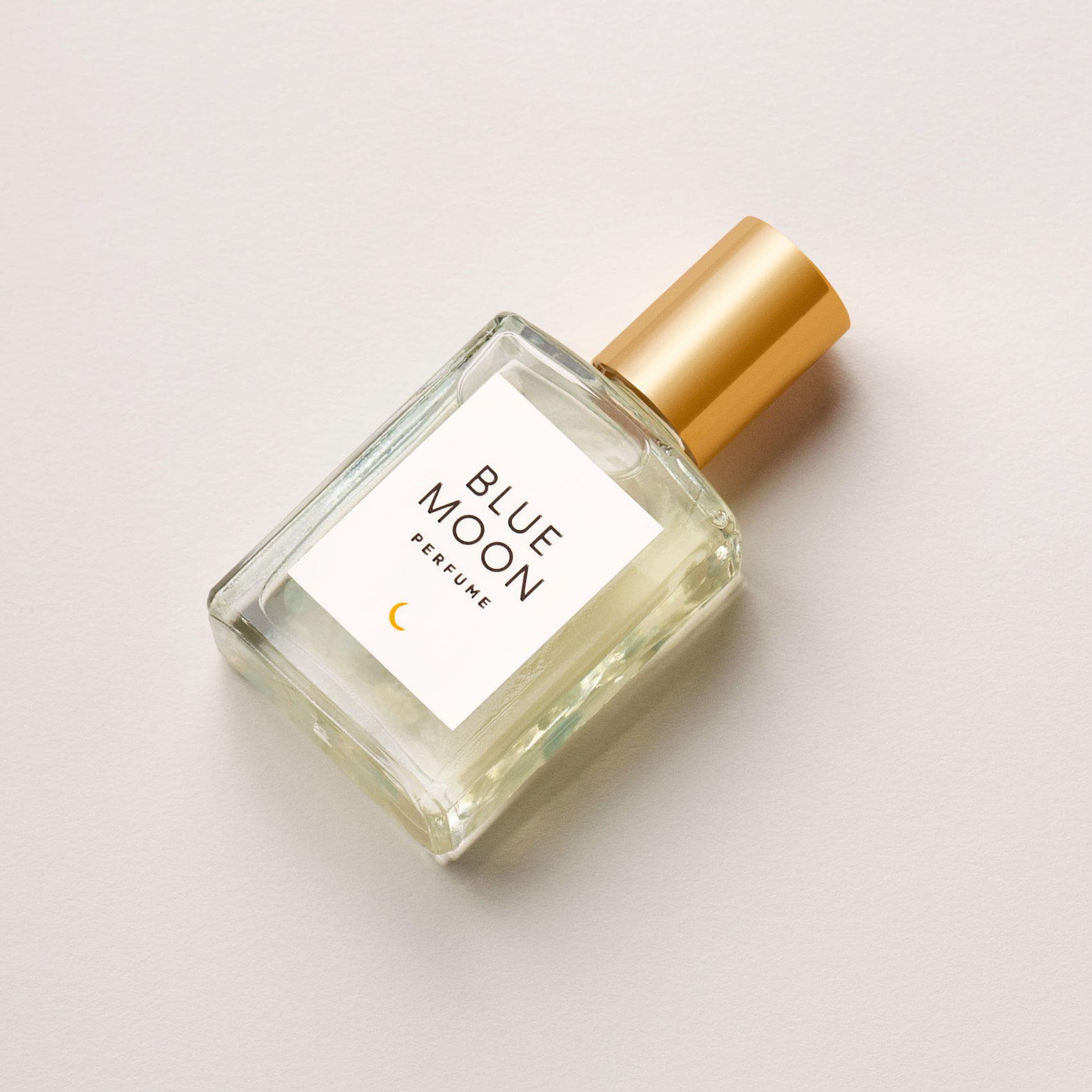 Olivine Atelier Blue Moon bottle ready for travel, long-lasting aroma on the go.