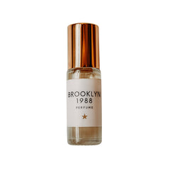 Olivine Atelier Brooklyn 1988 mini bottle displayed for on-the-go use, travel-ready fragrance