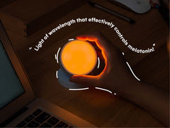 Olly Light Therapy Lamp compact size on bedside table