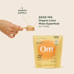 OM MUSHROOM SUPERFOOD bottle with spoon shows easy daily use.