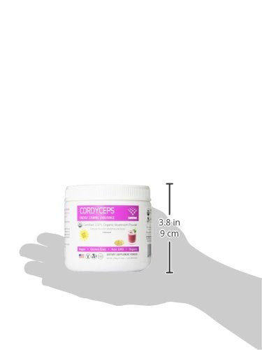 Pouring Om Cordyceps powder into a hot drink to boost energy.