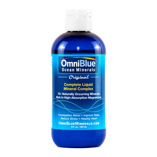 OmniBlue Ocean Minerals bottle poured into water for hydration support