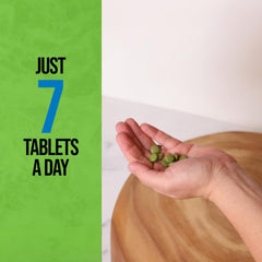 On Target Living Wheatgrass Tablets pouring from bottle, quick serving.