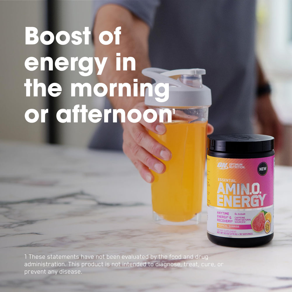 Powder close-up of Amino Energy Tropical Sunrise showing texture and color.
