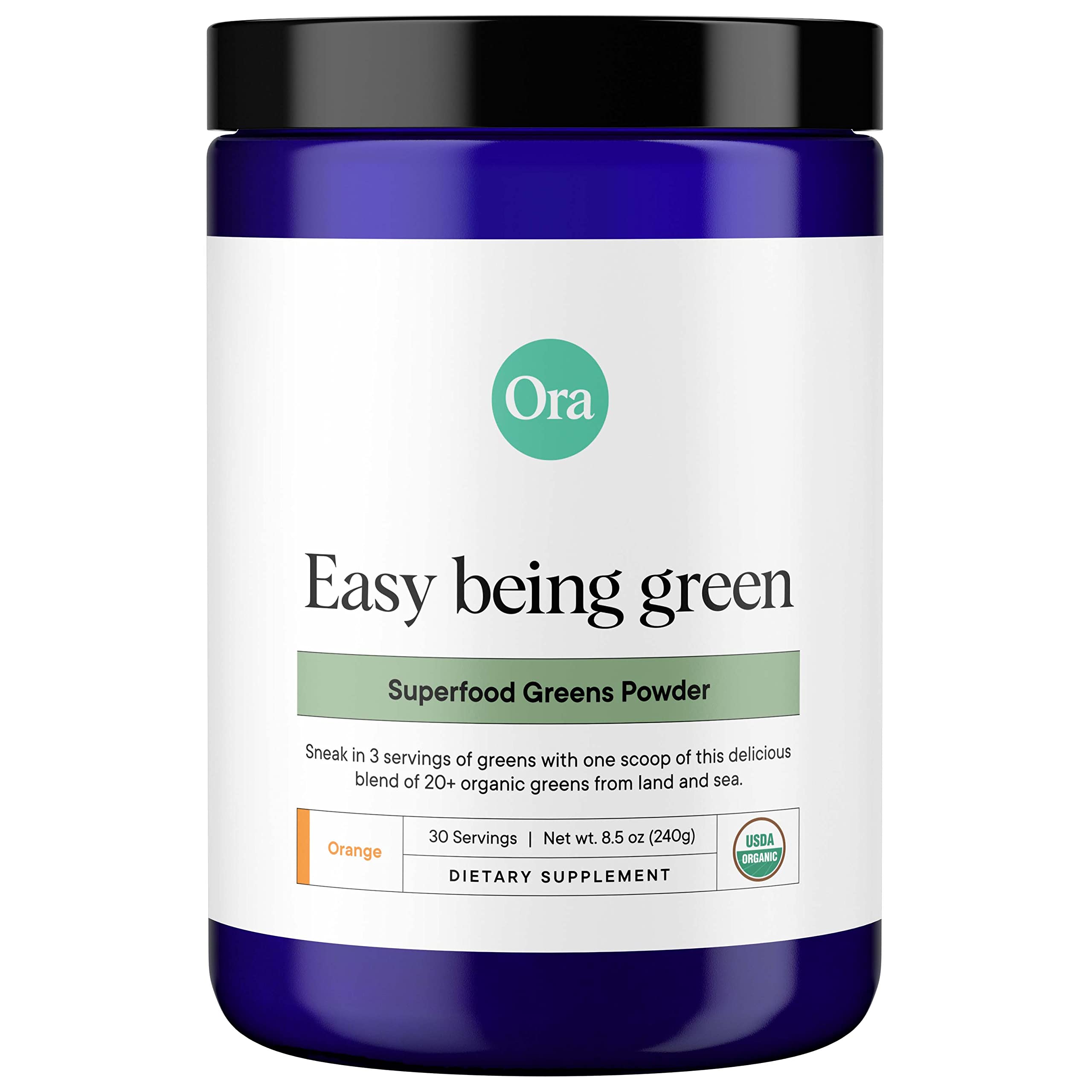 Ora Organic Greens Powder bottle with citrus flavor on kitchen counter