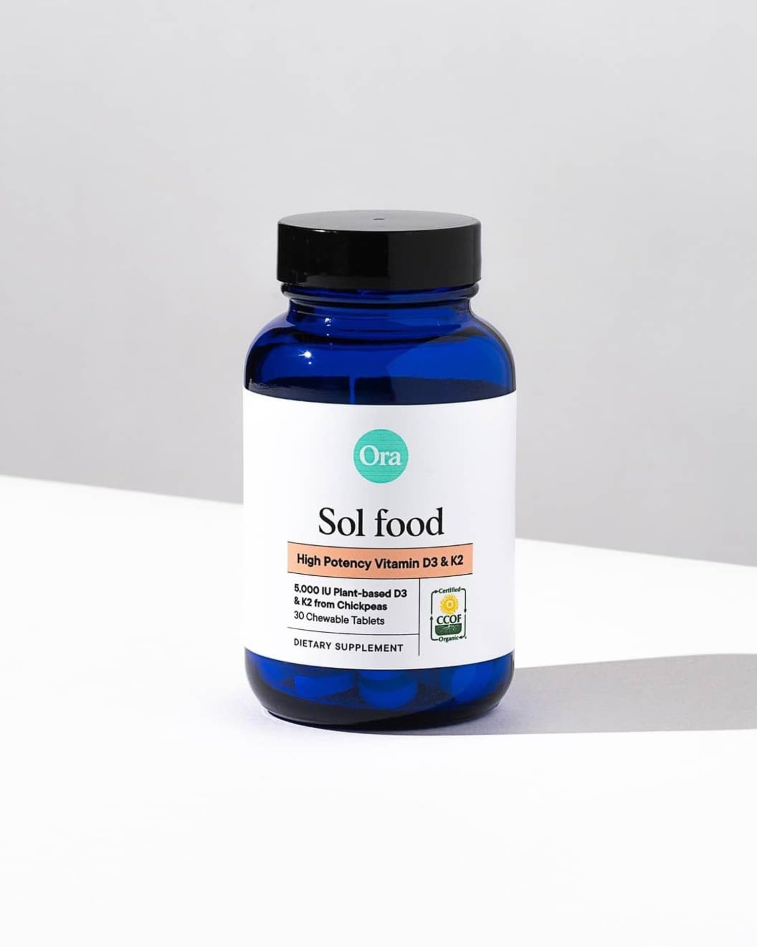Ora Organic vegan-certified packaging emphasizing eco-friendly sourcing and plant-based vitamins.