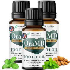 OraMD tooth oil bottle pouring for quick, fresh oral care at home.