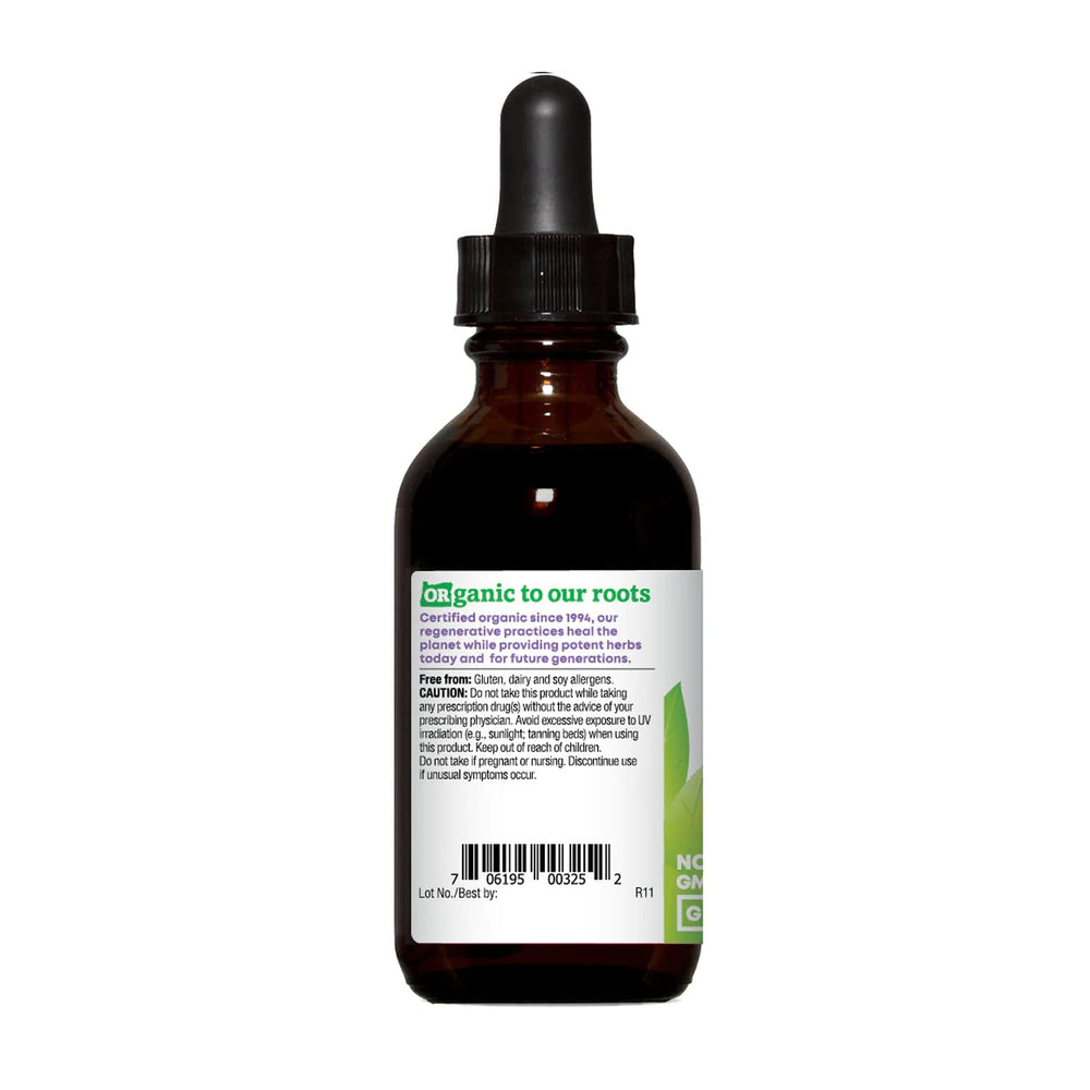 Pouring glycerite extract from Oregon's Wild Harvest bottle for herbal use