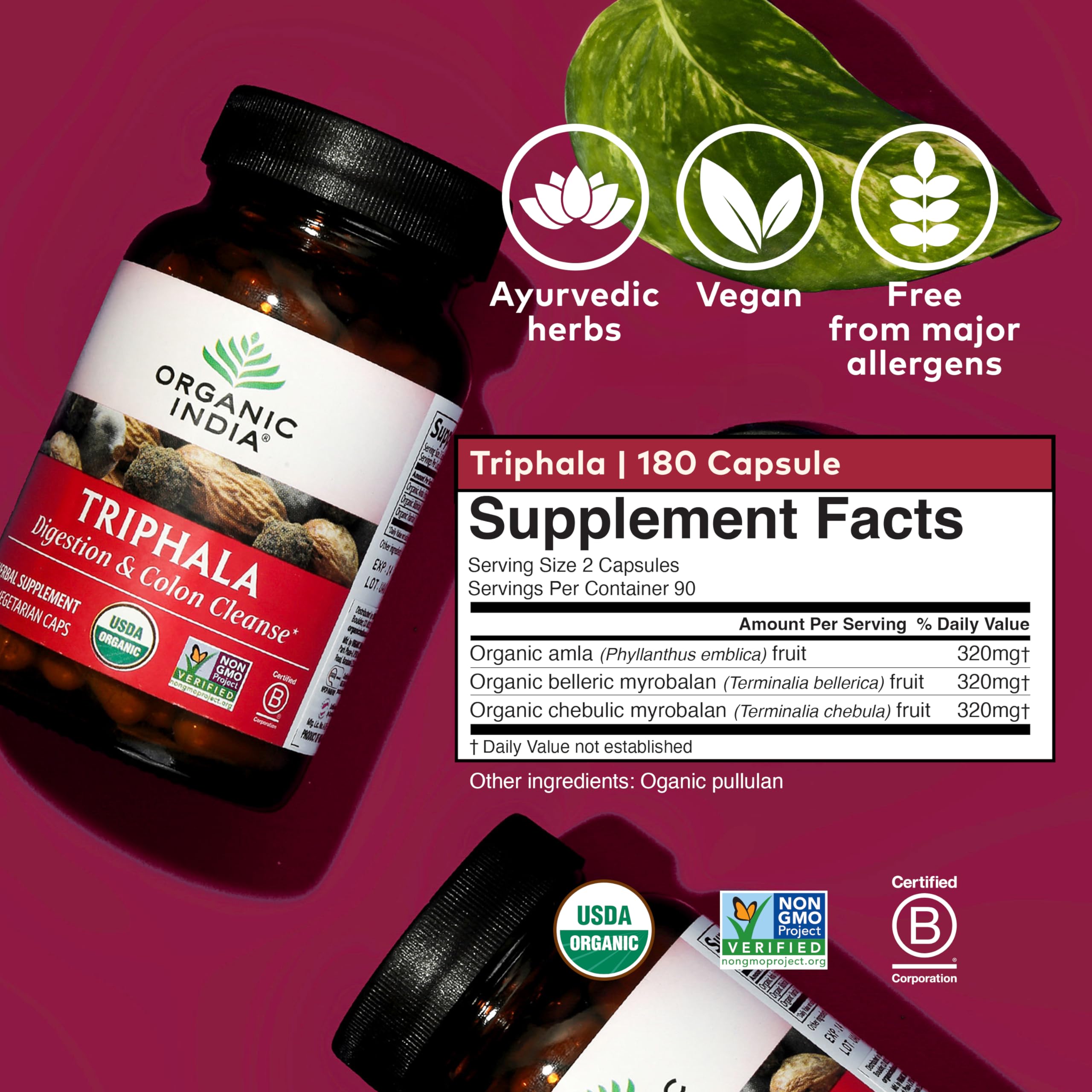 Triphala capsules in hand from Organic India for daily wellness.