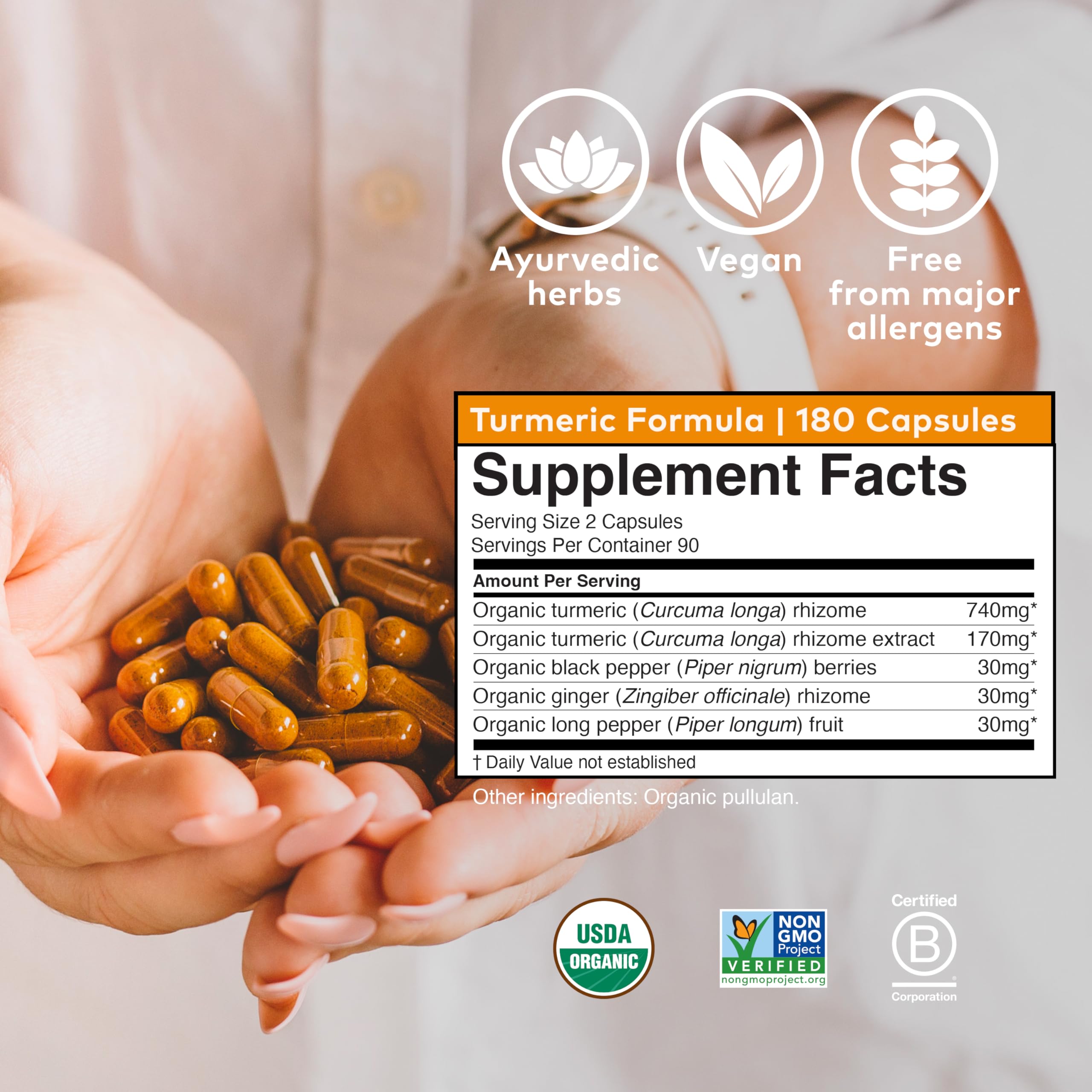 Organic India Turmeric Curcumin bottle with glass and water suggests daily use