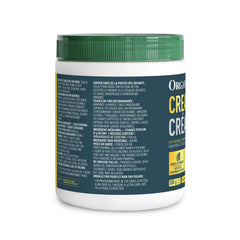 Athlete preparing Organika creatine powder before training session.