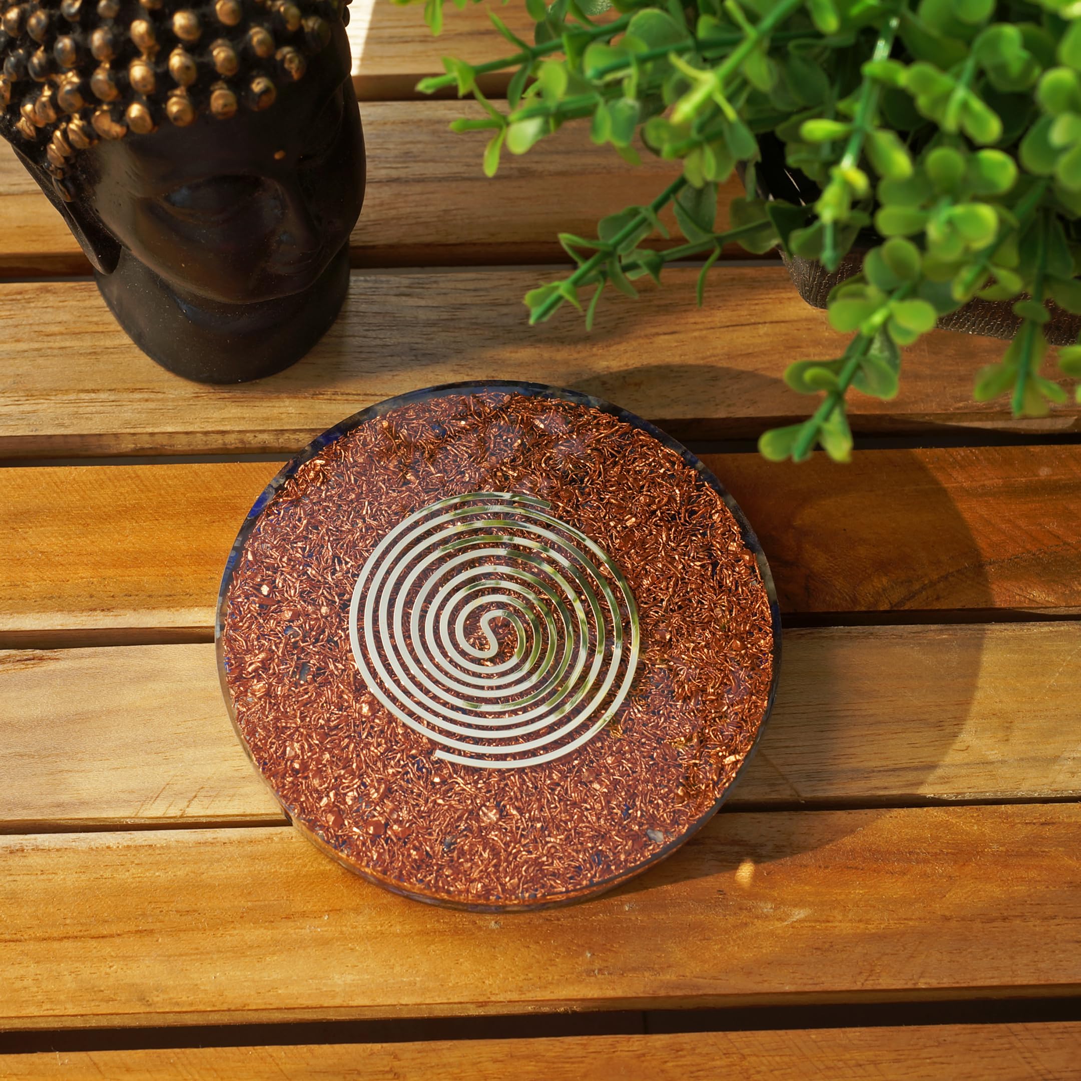 Orgonite Crystal Chakra healing plate balances energy during practice.