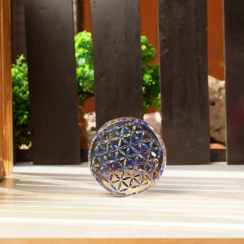 Orgonite Crystal Flower of Life emblem signifies interconnected energy for protection.