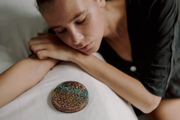 Orgonite Crystal Water Charging Plate shown in a calm room illustrating protective energy.
