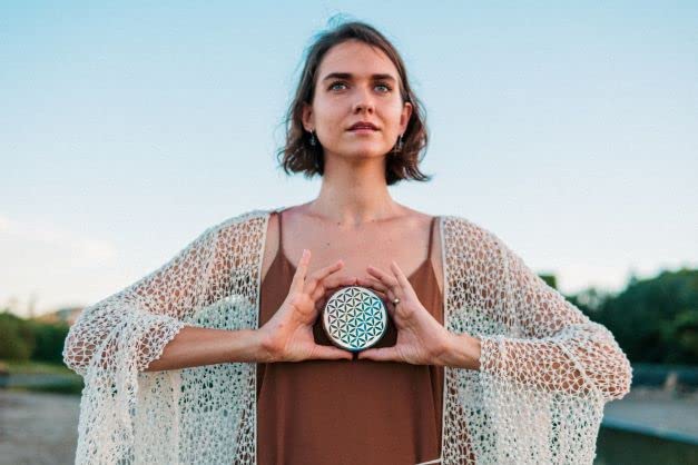 Orgonite Crystal Water Charging Plate with sage for cleansing energy.