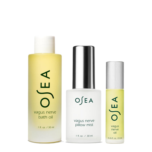 OSEA Vagus Nerve Oil application demonstrating circular neck massage for calm evenings.