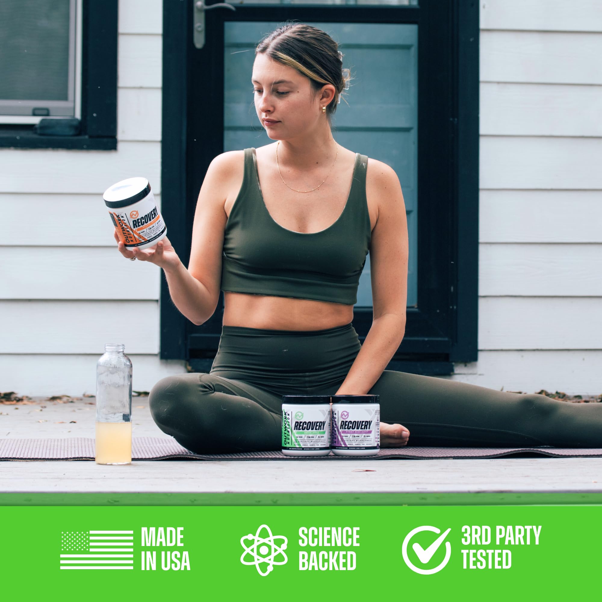 Athlete using Outwork Nutrition recovery powder in gym setting