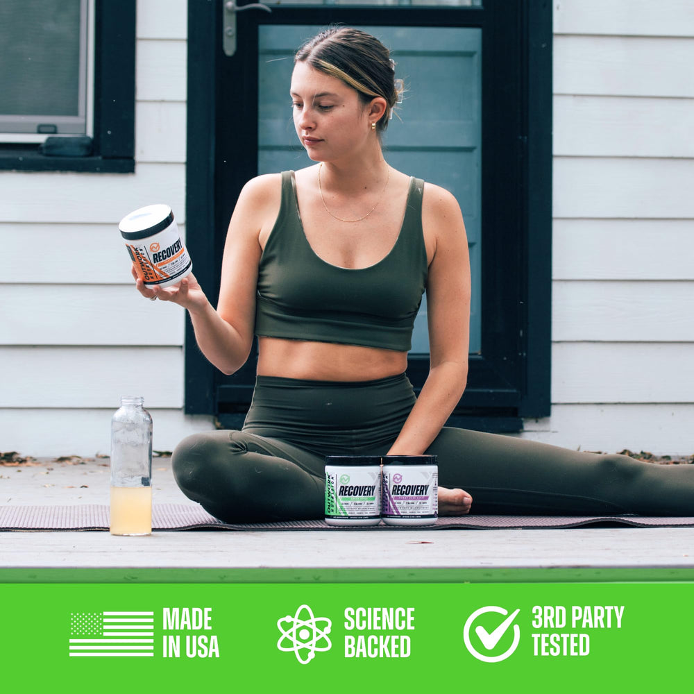 Athlete using Outwork Nutrition recovery powder in gym setting