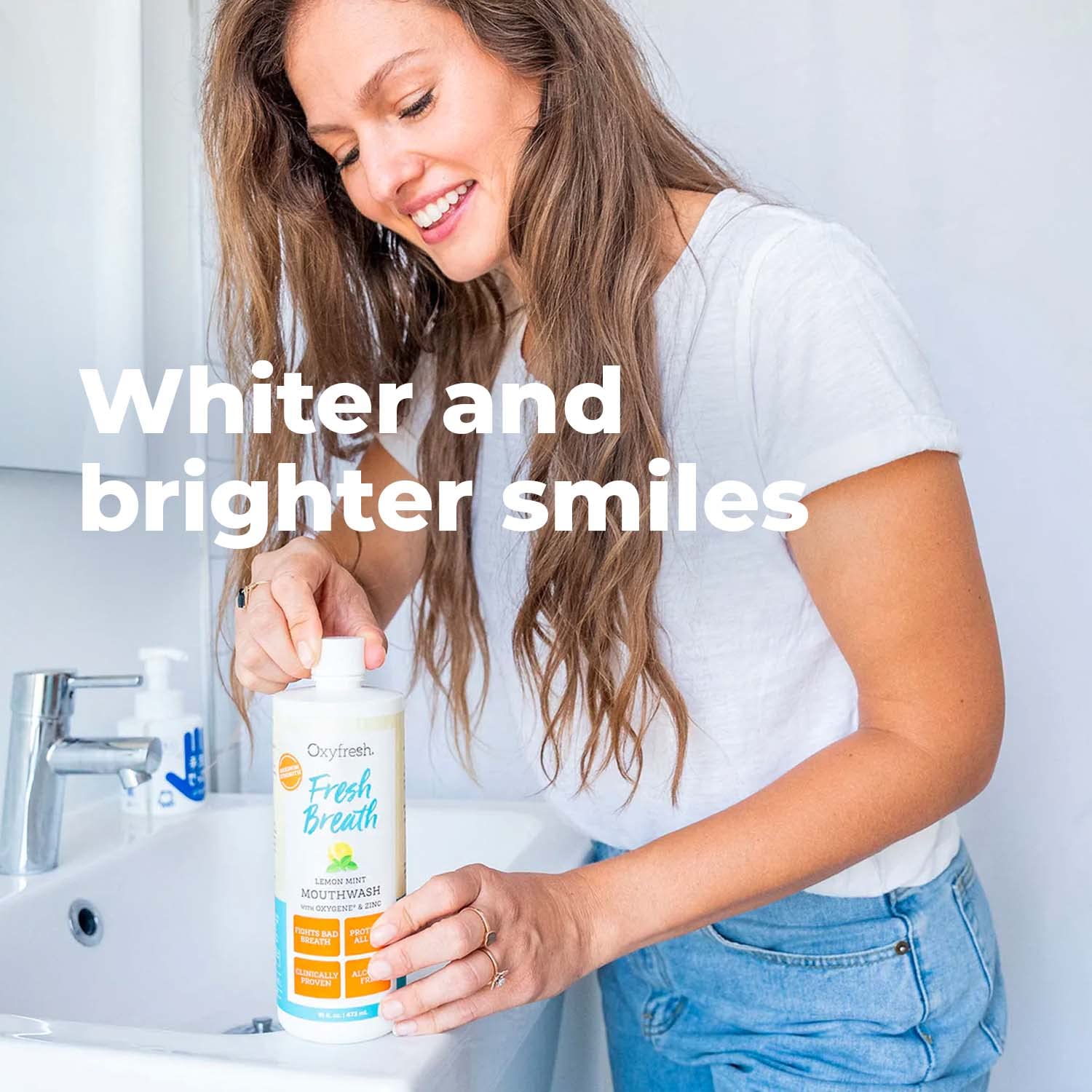 Oxyfresh Lemon Mint bottle next to toothbrush illustrating daily routine.