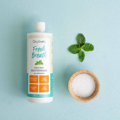 Oxyfresh Fresh Mint mouthwash being poured for a quick, refreshing rinse.