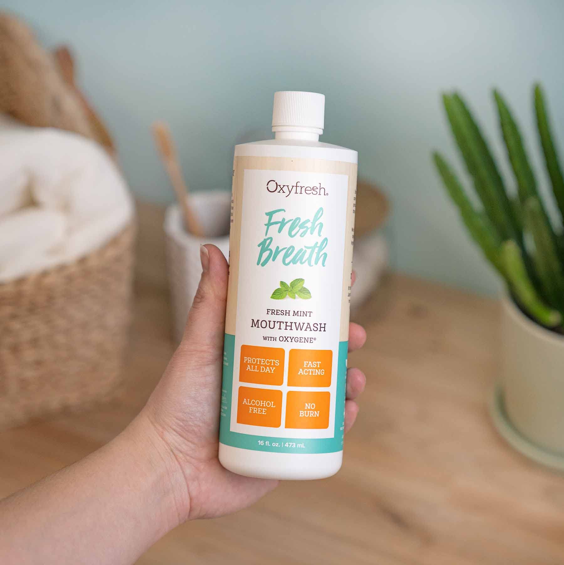 Oxyfresh mouthwash glass rinse ready for a refreshing finish after use.