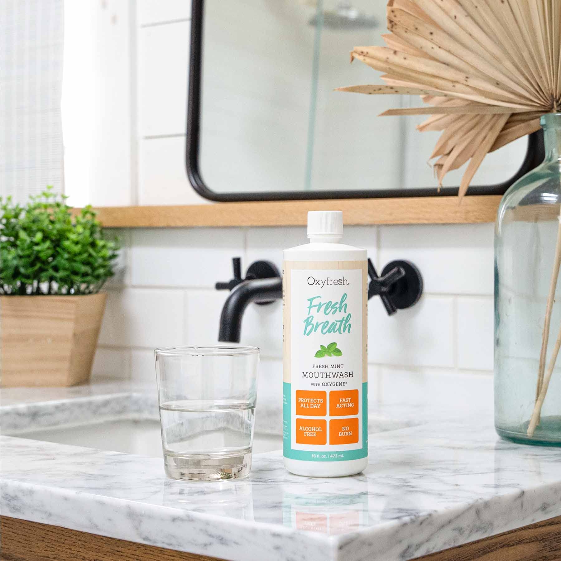 Oxyfresh pack of three display emphasizes convenient daily care value.