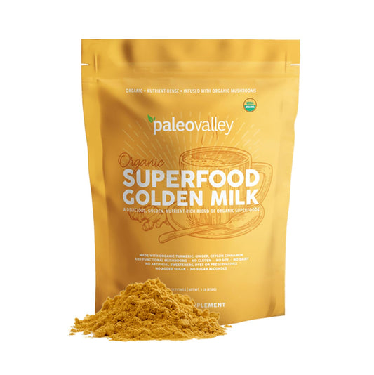 Paleovalley Organic Superfood Golden Milk canister on countertop for a daily vitality ritual.