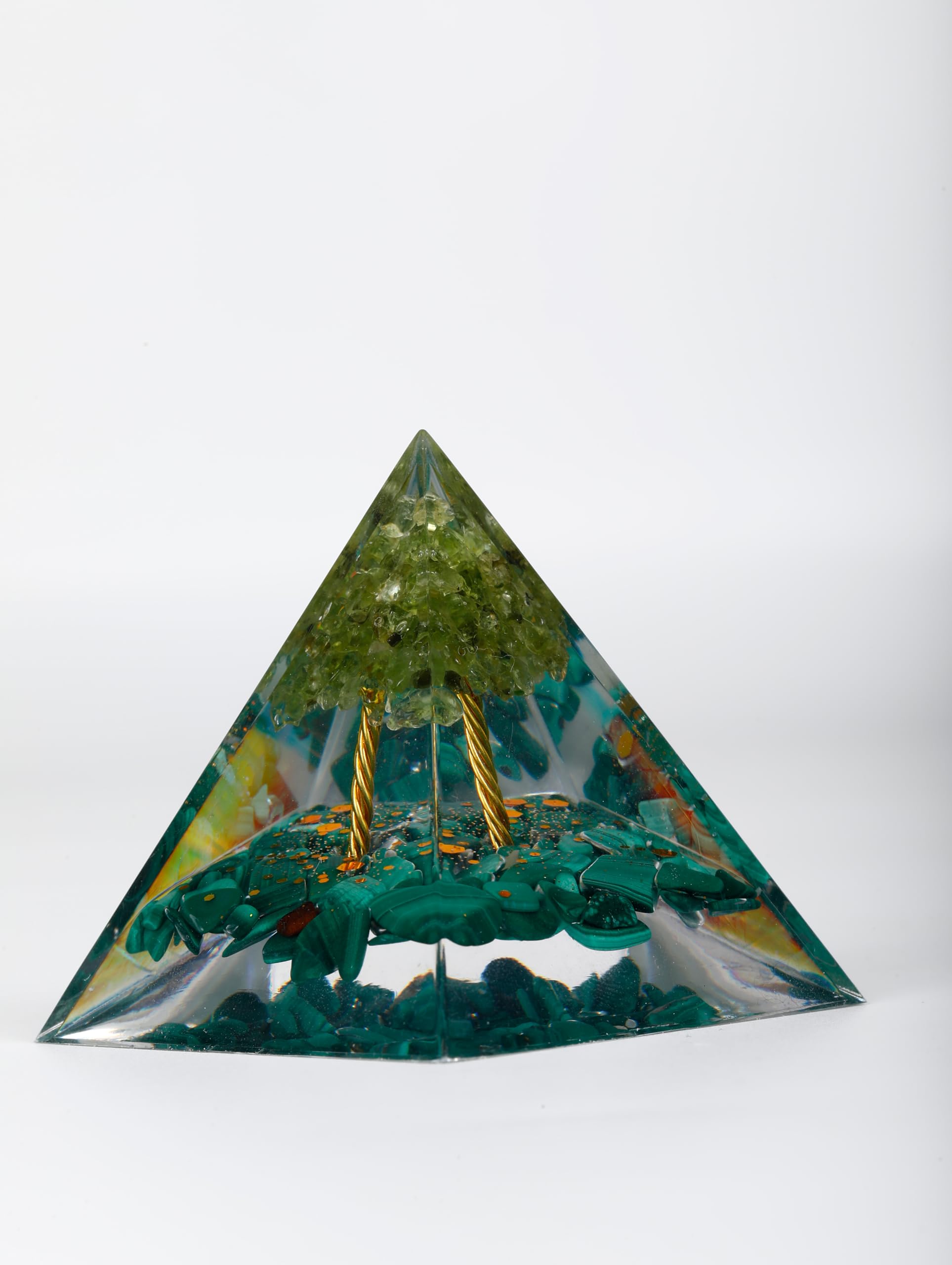 Pankósmios orgonite pyramid with obsidian helps absorb negativity and soothe nerves