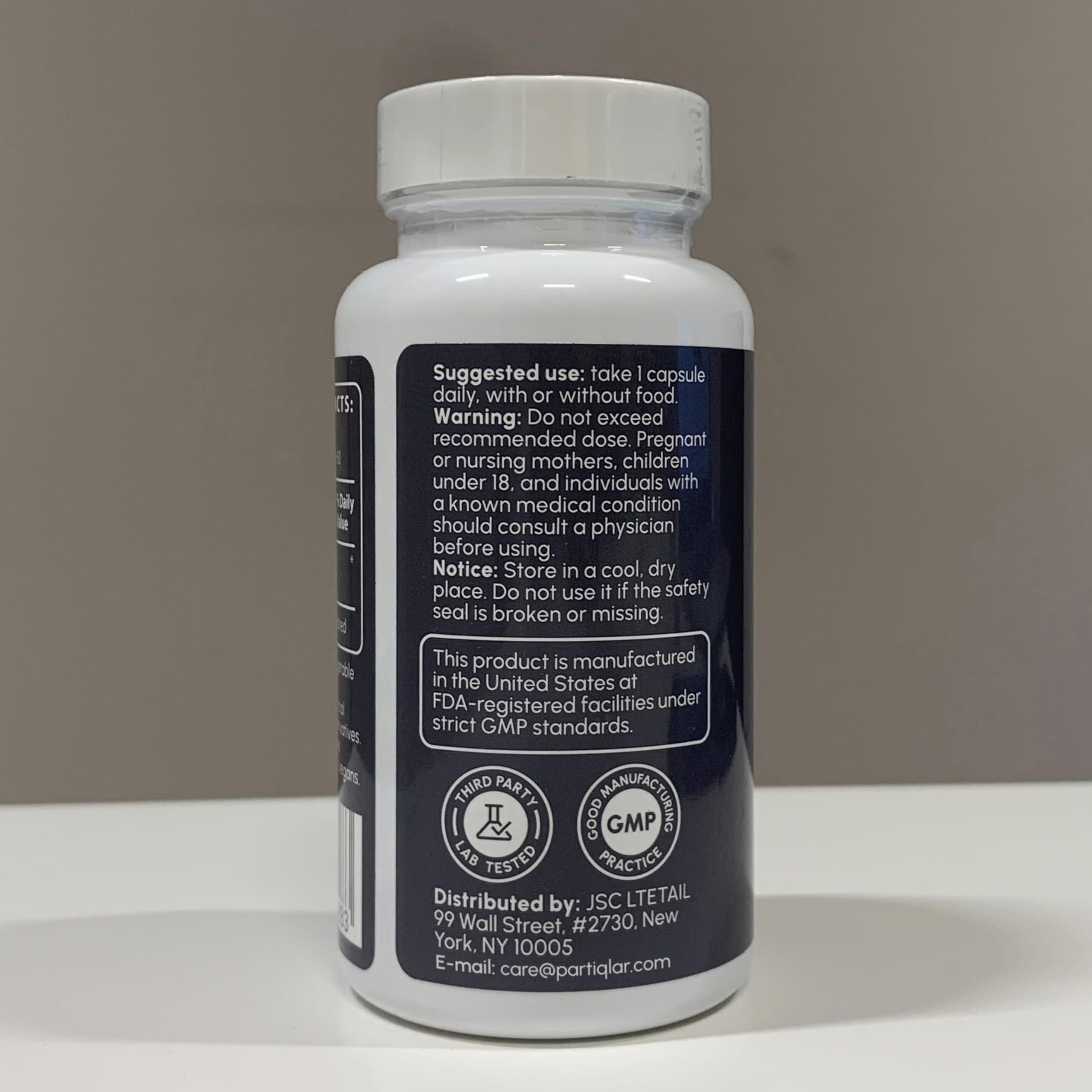 partiQlar NR bottle with glass to evoke daily wellness routine