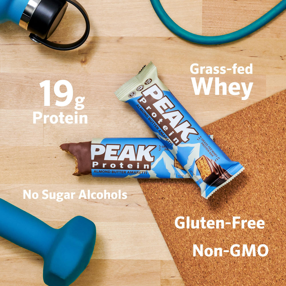 Peak Protein bar cross-section shows organic milk chocolate and protein-rich center for quick energy.