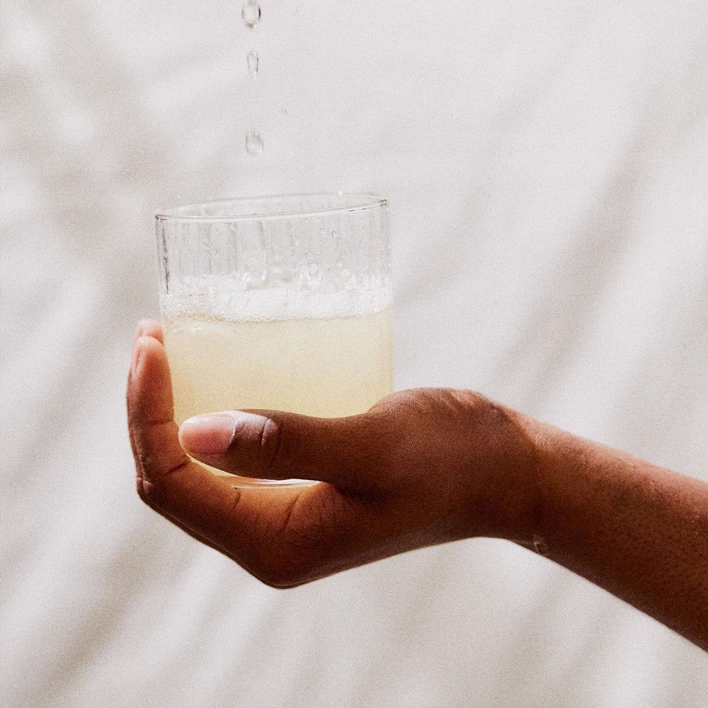 Perelel mango lemonade flavor in a glass