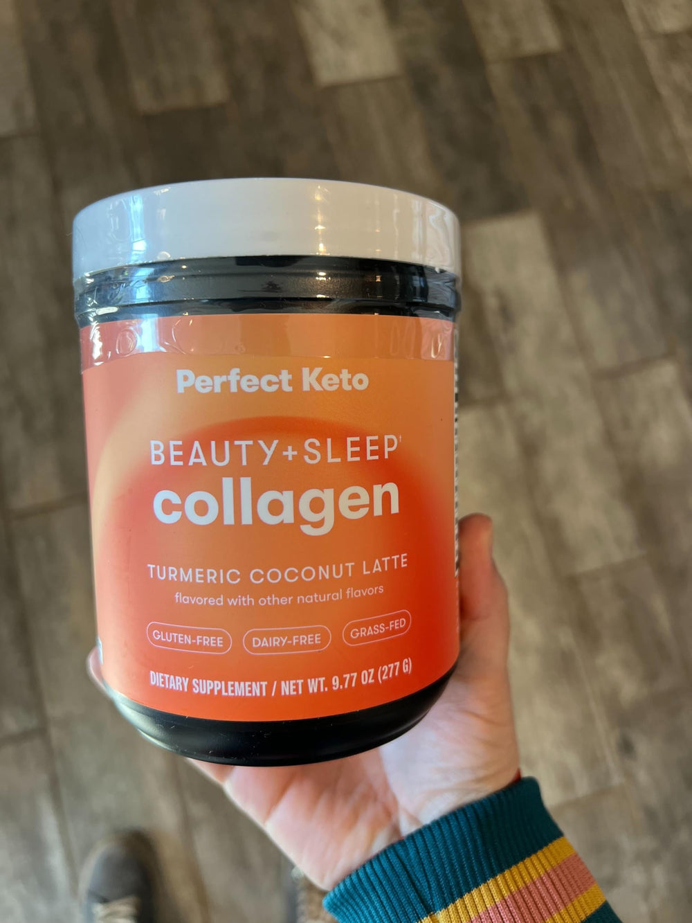Perfect Keto Beauty + Sleep powder mix in glass ready for hot or cold latte