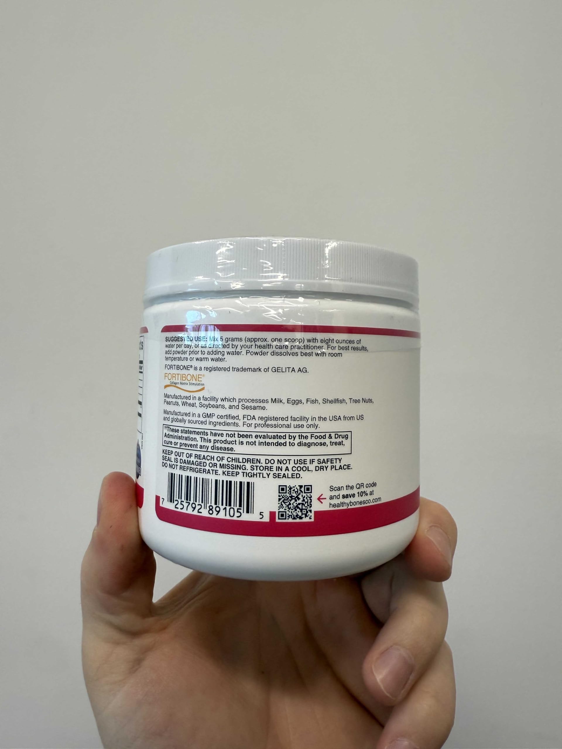 Person stirring Fortibone into a cup for convenient intake.
