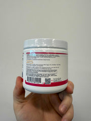 Person stirring Fortibone into a cup for convenient intake.